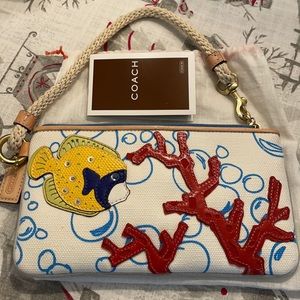 Authentic vintage NWT Coach fish bubbles wristlet.